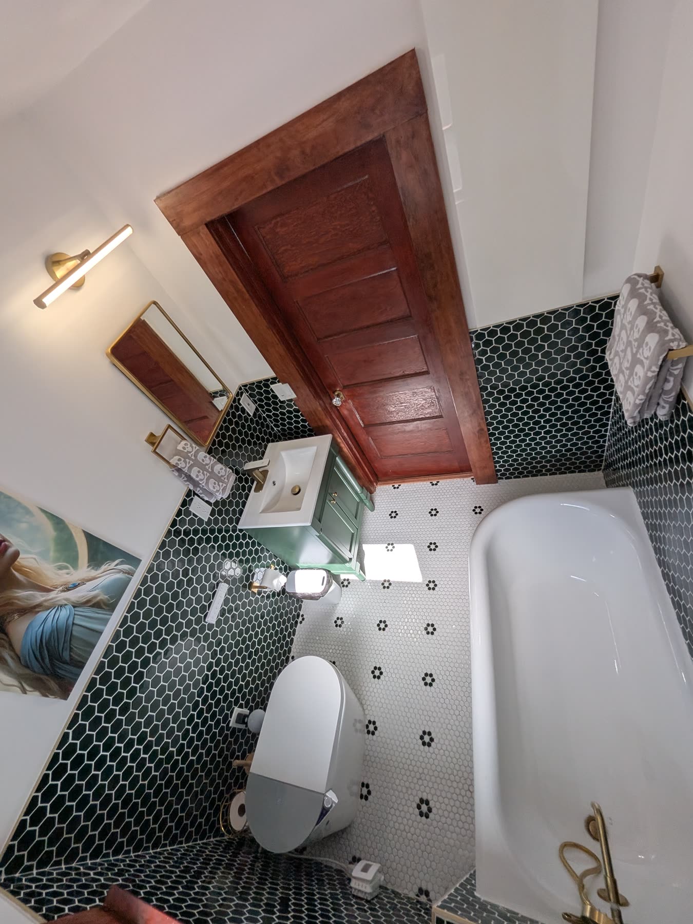 Bathroom with green penny tile and soaking tub